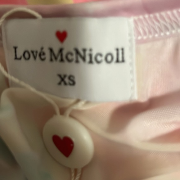 Love McNicoll pretty pastel coloured dress with a peach long camisole underneath - Picture 5 of 7